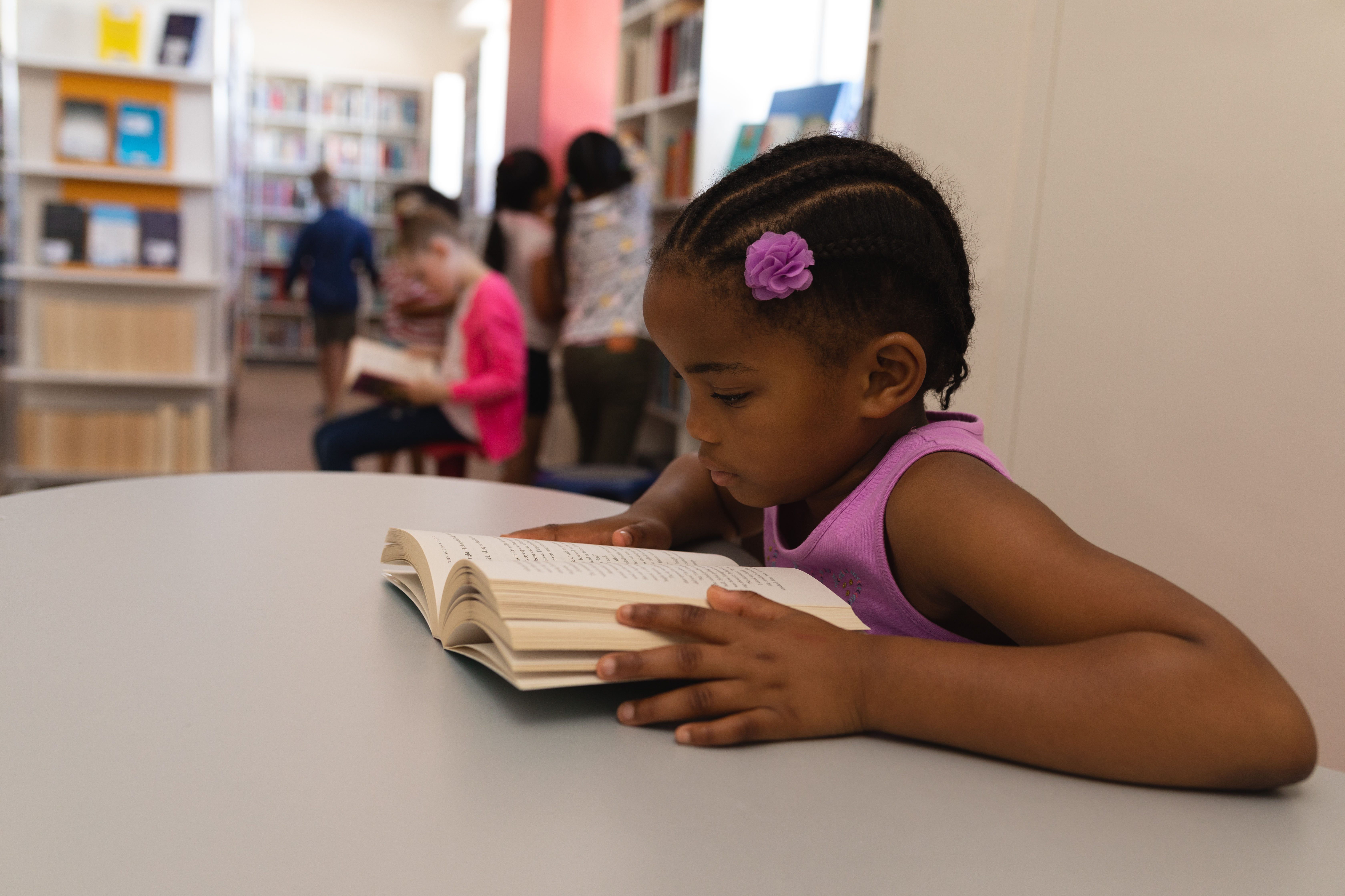 school girl reading book